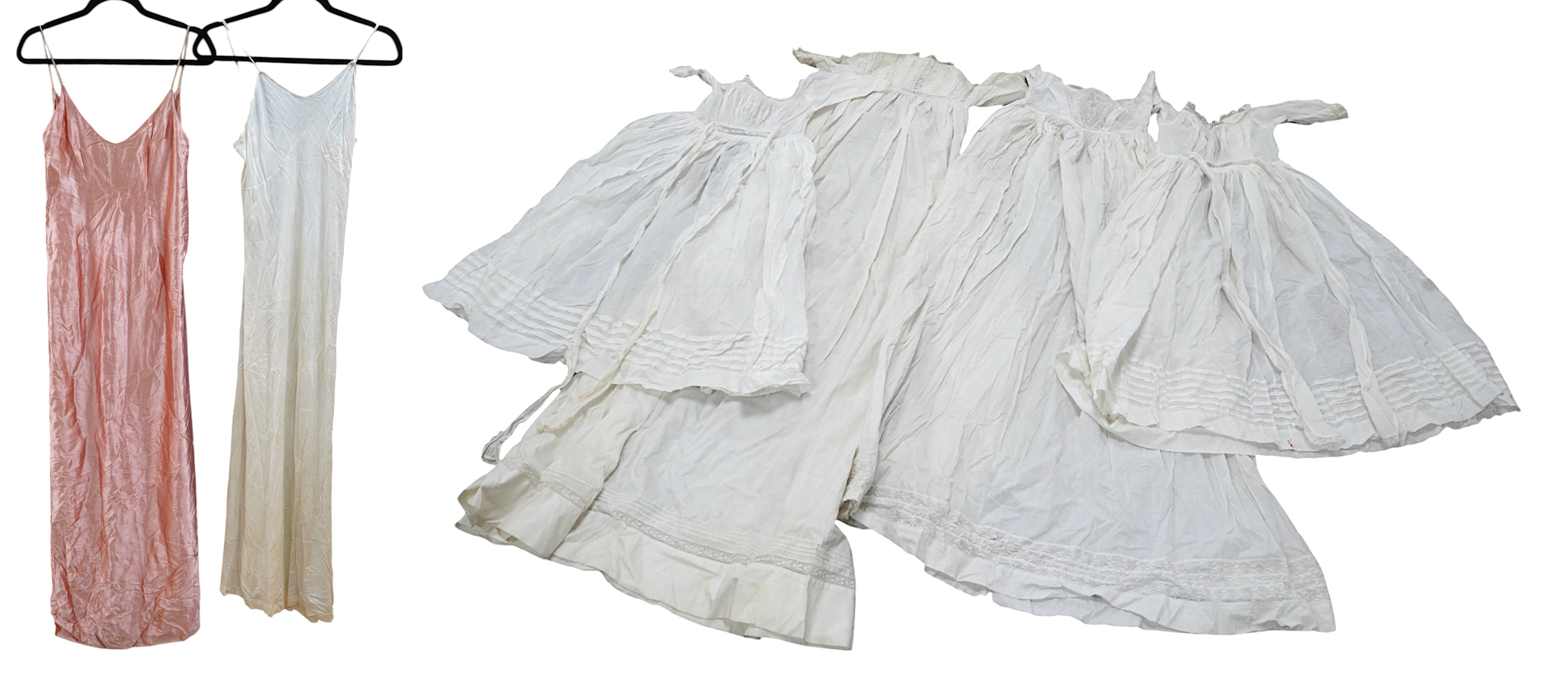 Two late 19th early 20th century long baby night gowns and two shorter baby gowns, together with a pink satin ladies full length slip and a similar cream silk stockinette slip, the bodices worked on baby dresses are embr